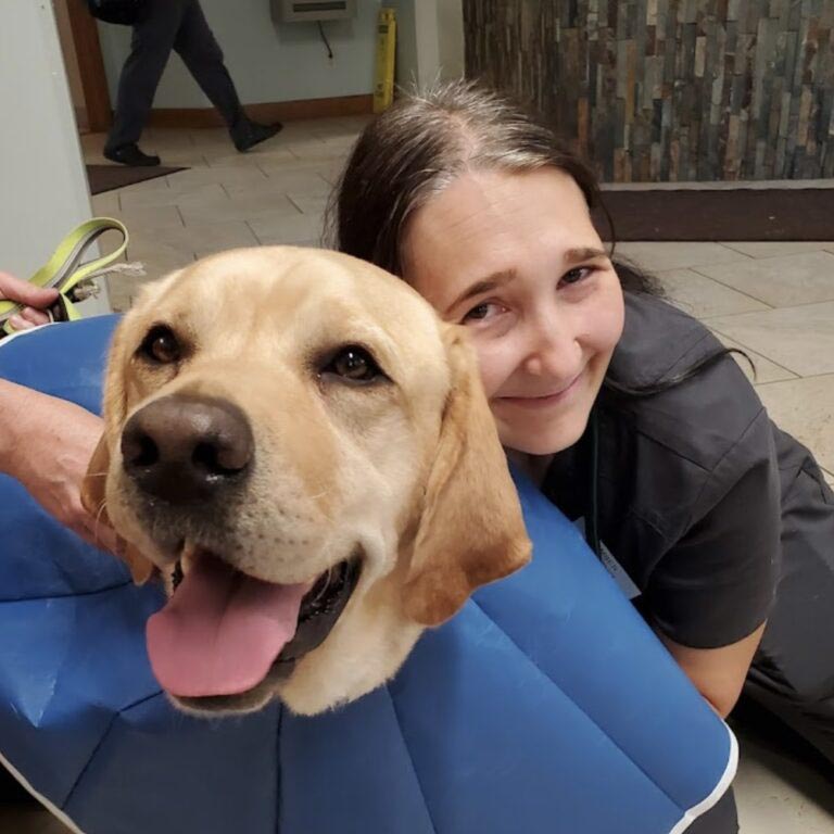 Amber posing for a phot with a patient