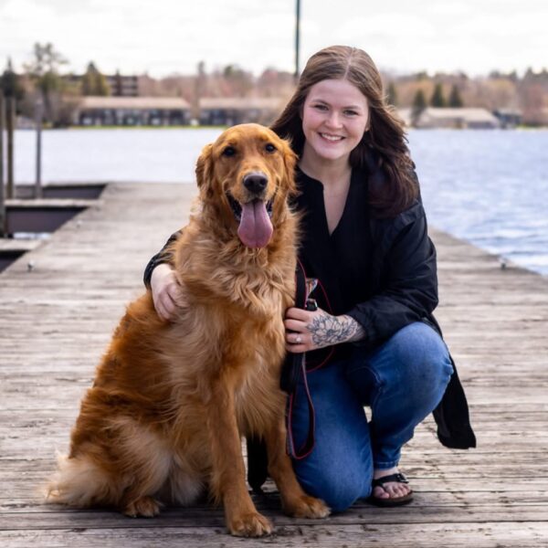 Logan on the dock with her dog