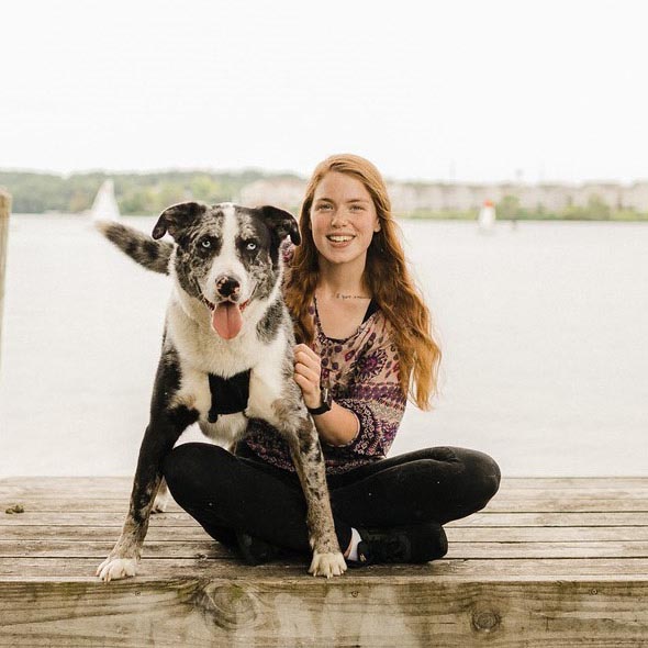 Maddison by the water with her dog