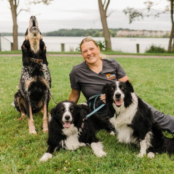 Sam with her three dogs