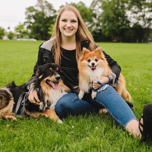 Samantha in the park with her two dogs