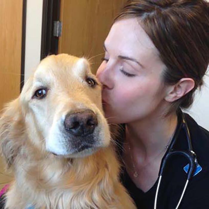 Whitney Jencka kissing her dog